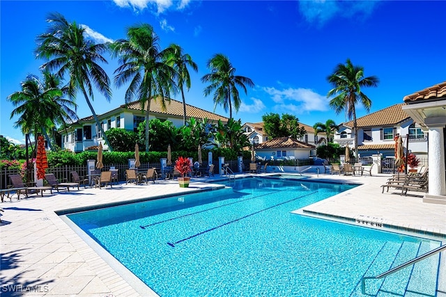 view of swimming pool with a patio