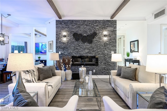 living room with beam ceiling, wood-type flooring, and ornamental molding