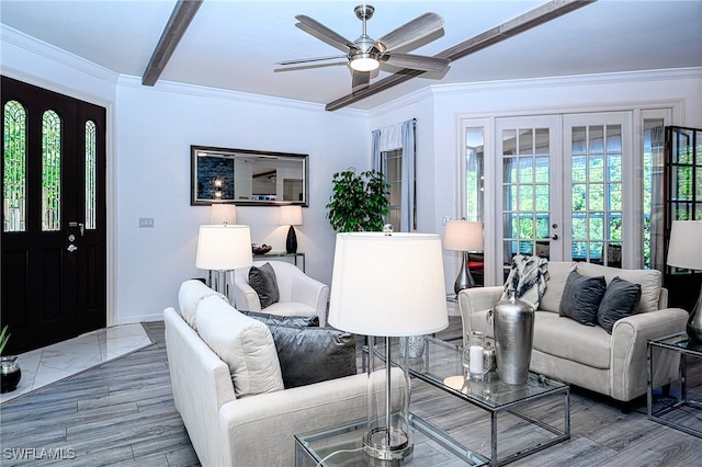 living room featuring beam ceiling, a wealth of natural light, french doors, and hardwood / wood-style flooring