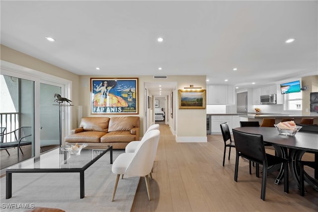 living room with light hardwood / wood-style flooring