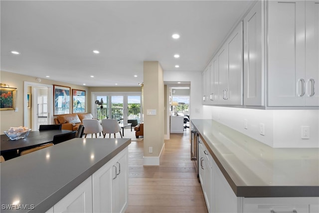 kitchen with white cabinetry and light hardwood / wood-style floors