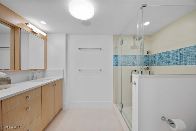 bathroom with vanity and an enclosed shower