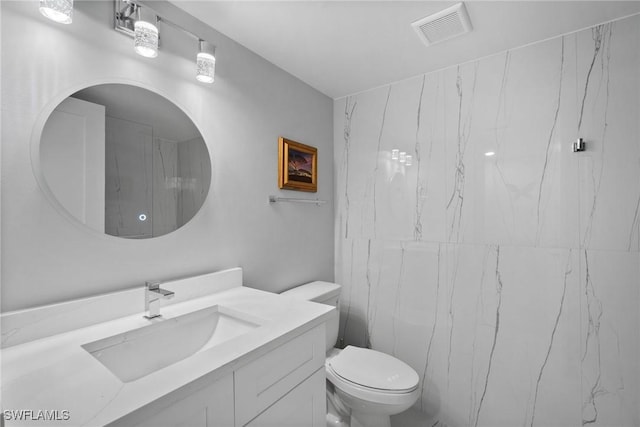 12170 Kelly Sands Way Unit 702, Fort Myers, FL 33908 - bathroom with vanity and toilet