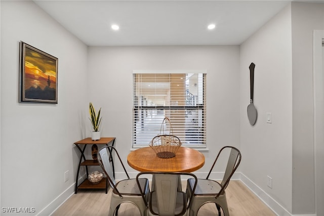 dining area with light hardwood / wood-style flooring