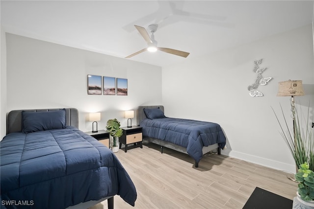 bedroom featuring ceiling fan and light hardwood / wood-style floors