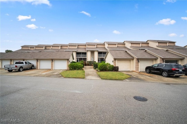 12540 Kelly Greens Blvd Unit 327, Fort Myers, FL 33908 - multi unit property featuring stucco siding and community garages