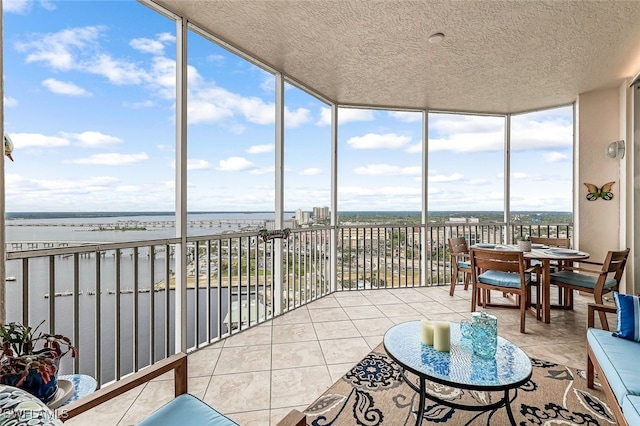 sunroom with a water view