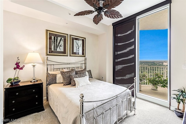 bedroom featuring access to exterior, light colored carpet, and ceiling fan