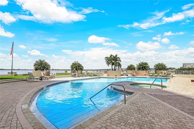 view of swimming pool with a patio area and a community hot tub