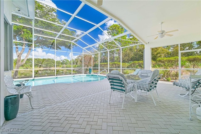 view of pool featuring ceiling fan, a lanai, and a patio