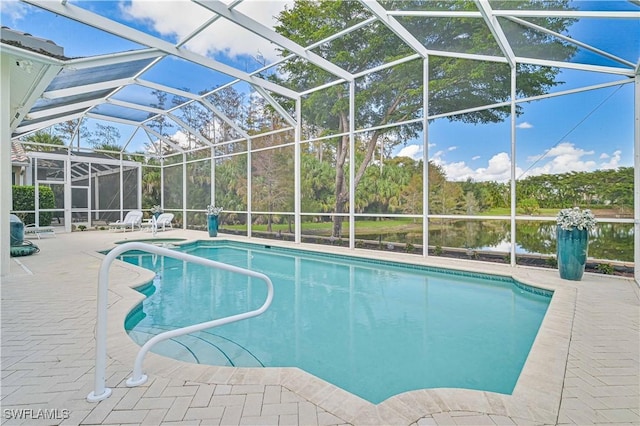 view of swimming pool with a lanai, a water view, and a patio area