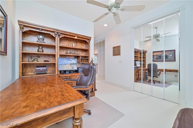 office featuring ceiling fan, light colored carpet, and french doors