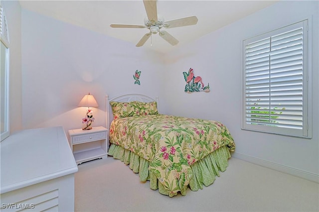 bedroom with ceiling fan and carpet