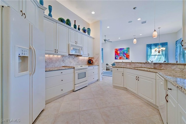 kitchen with ceiling fan, decorative backsplash, white cabinets, and white appliances