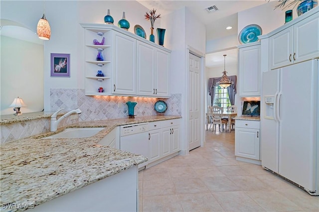 kitchen with white cabinetry, backsplash, white appliances, pendant lighting, and sink