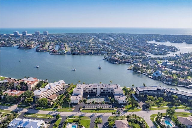 birds eye view of property featuring a water view