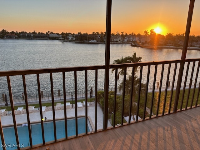 balcony at dusk with a water view