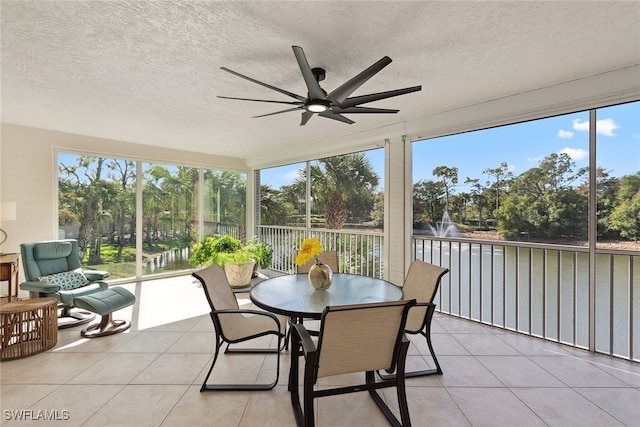 sunroom featuring ceiling fan