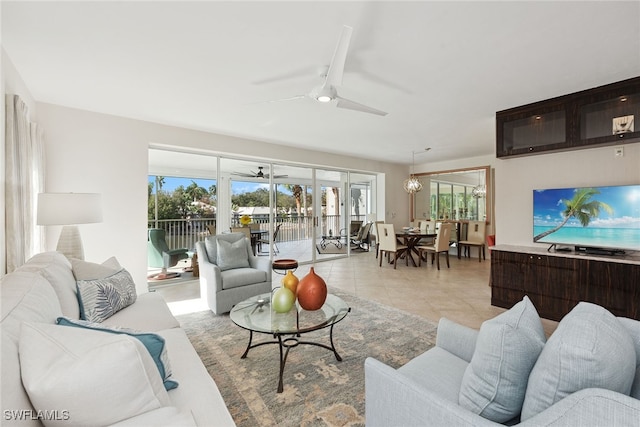 living room featuring ceiling fan and light tile patterned floors