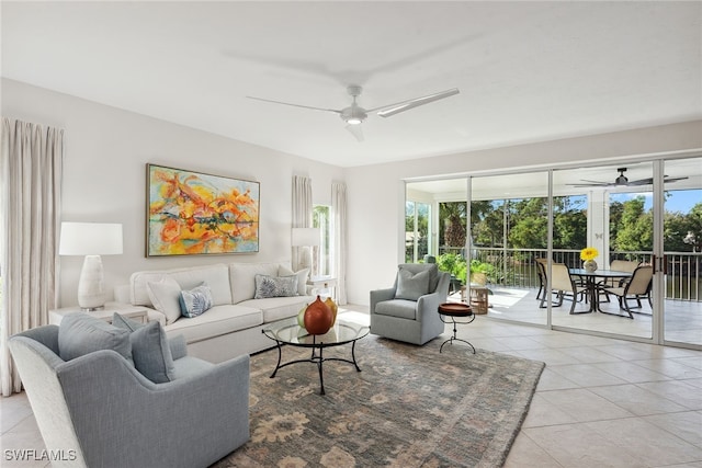 living room featuring ceiling fan, a healthy amount of sunlight, and light tile patterned floors