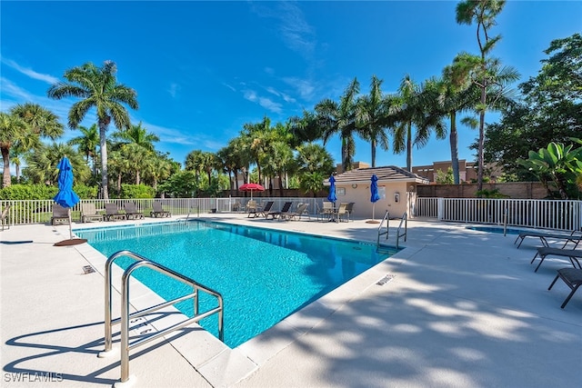 view of swimming pool featuring a patio area