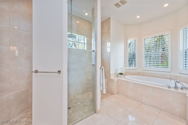 bathroom with plenty of natural light, tile patterned floors, and independent shower and bath