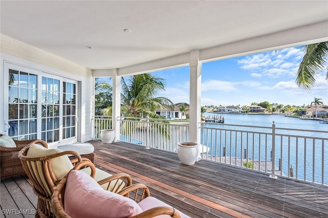 wooden terrace with a water view