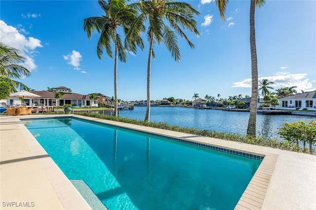 view of swimming pool featuring a water view