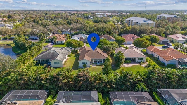 birds eye view of property featuring a water view