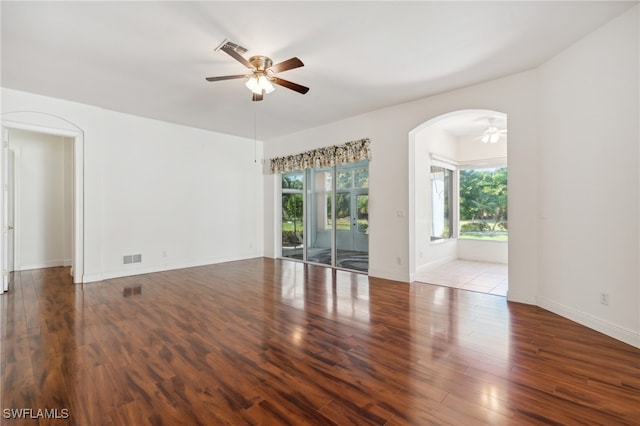 unfurnished room featuring ceiling fan and hardwood / wood-style floors