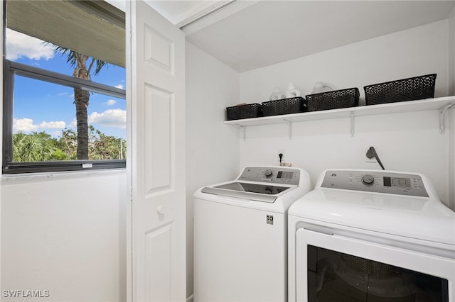 laundry area featuring washing machine and clothes dryer