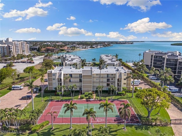 birds eye view of property with a water view