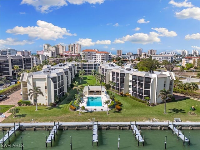 birds eye view of property with a water view