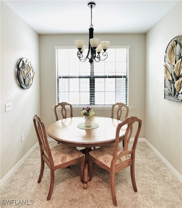 dining space featuring a chandelier