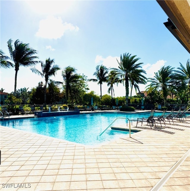 view of swimming pool with a patio