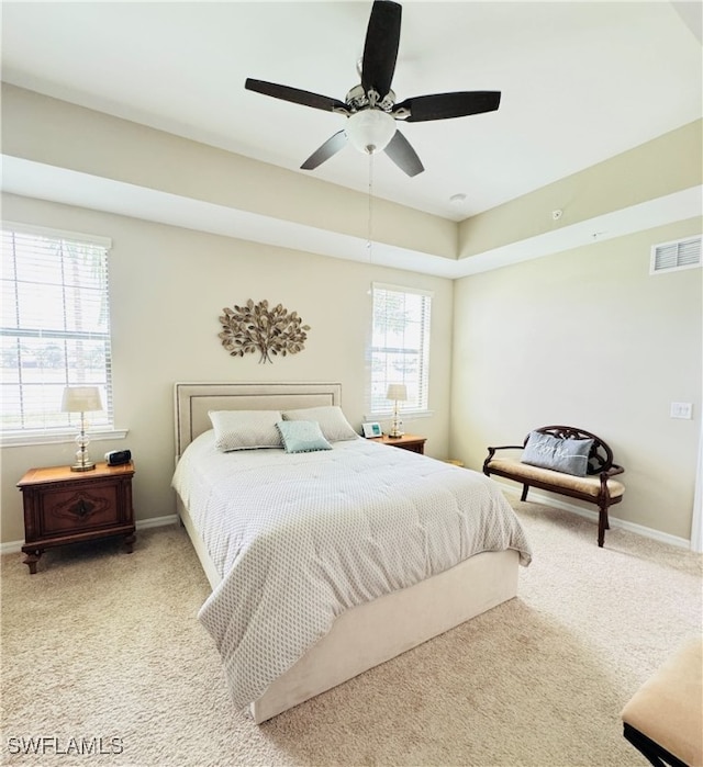 bedroom featuring ceiling fan and light colored carpet