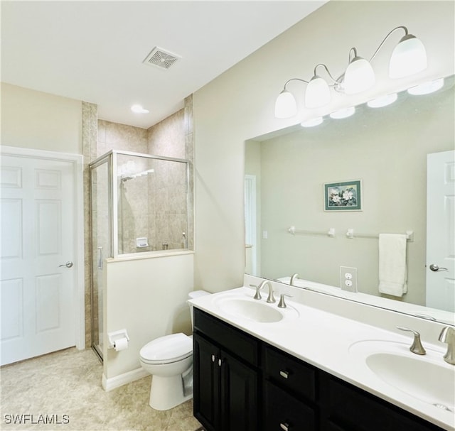 bathroom with walk in shower, tile patterned flooring, vanity, and toilet