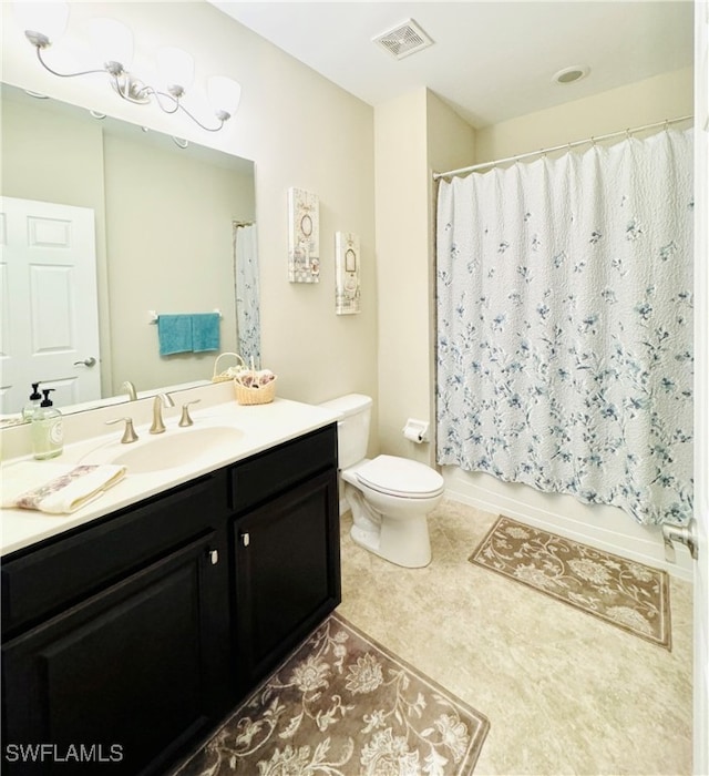 full bathroom with tile patterned floors, vanity, toilet, and shower / tub combo