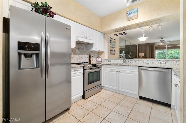 kitchen with ceiling fan, white cabinets, stainless steel appliances, and light tile patterned floors