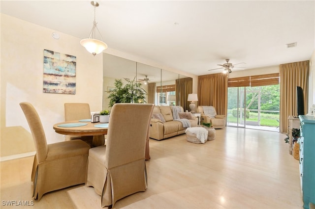 dining room featuring light hardwood / wood-style flooring and ceiling fan