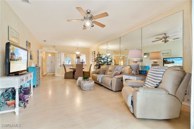 living room featuring light wood-type flooring and french doors