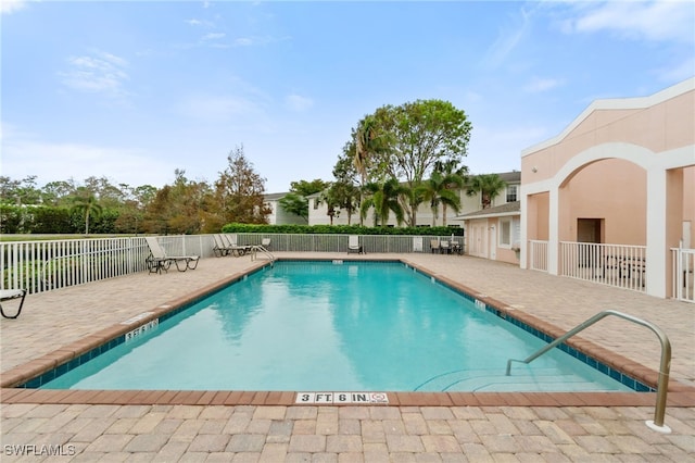 view of swimming pool featuring a patio