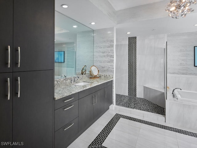 bathroom featuring vanity, tile patterned flooring, and plus walk in shower