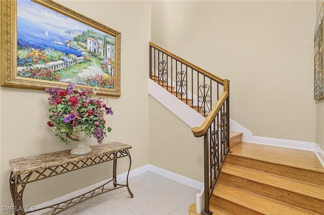 staircase with wood-type flooring