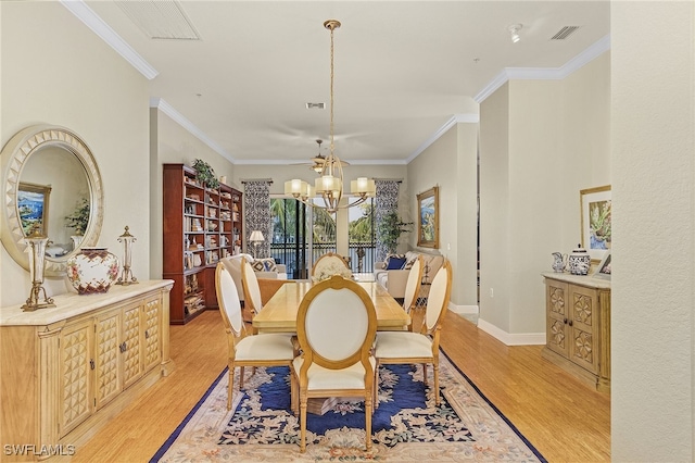 dining area featuring ornamental molding, an inviting chandelier, and light hardwood / wood-style floors