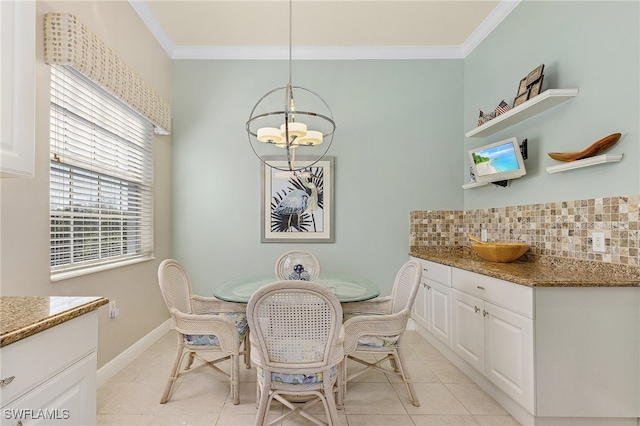 tiled dining area with an inviting chandelier and crown molding