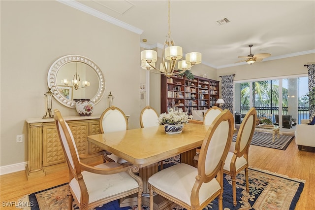 dining room featuring ornamental molding, ceiling fan with notable chandelier, and wood-type flooring