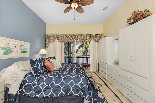 bedroom featuring light hardwood / wood-style flooring, ceiling fan, and access to exterior