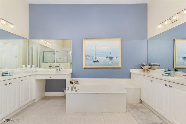 bathroom with a high ceiling, vanity, tile patterned floors, and separate shower and tub