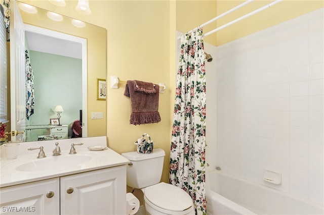 full bathroom with toilet, vanity, and shower / bath combo with shower curtain